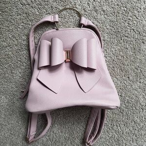 Chic Pink Bow Backpack with Structured Design